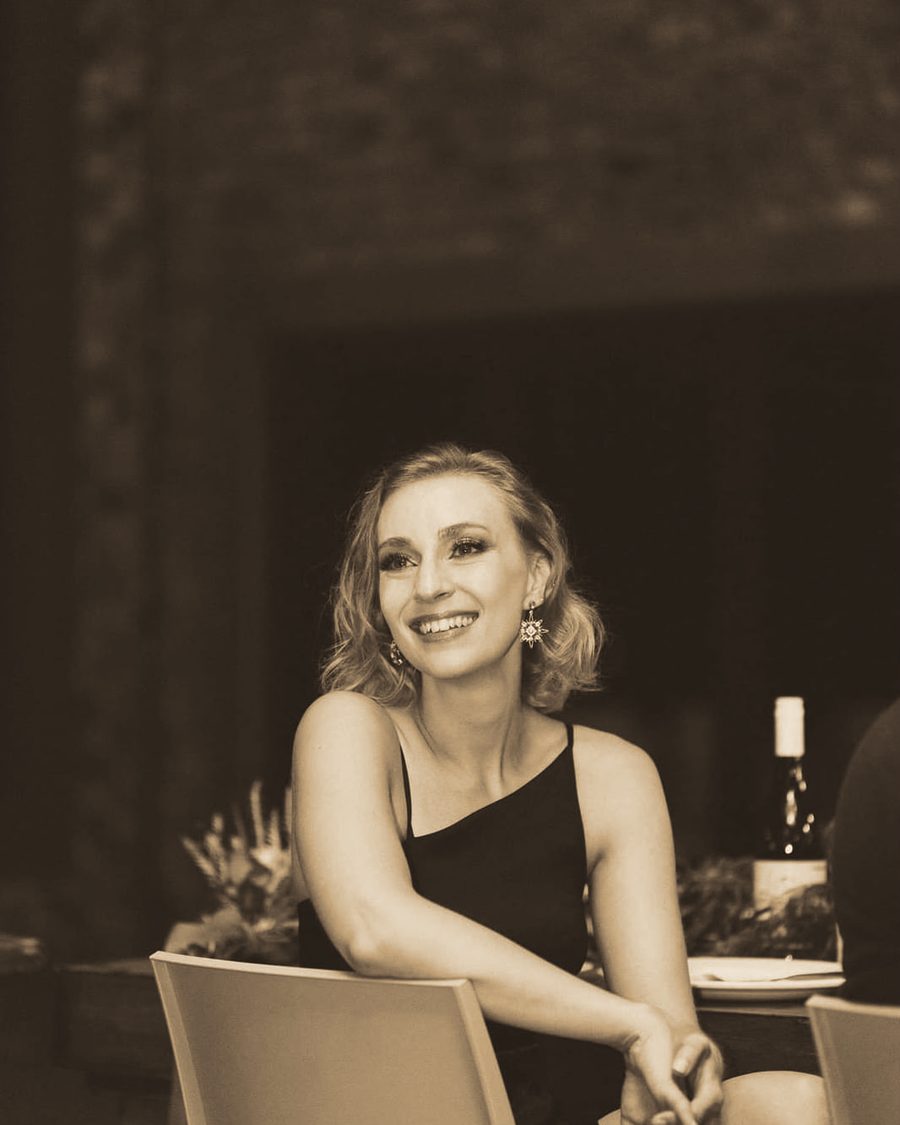 René smiling at a dinner table